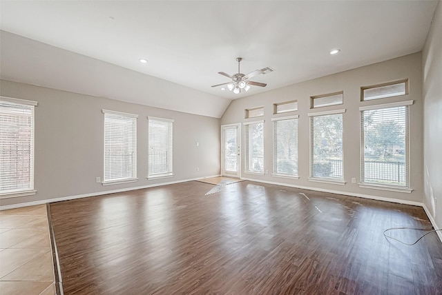 empty room with hardwood / wood-style floors, ceiling fan, and lofted ceiling