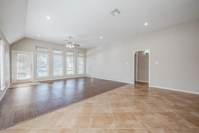 unfurnished living room with ceiling fan, lofted ceiling, and light hardwood / wood-style flooring