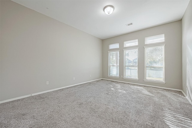 unfurnished room featuring carpet floors