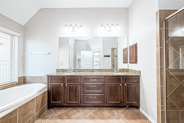 bathroom featuring tile patterned floors, vanity, plus walk in shower, and lofted ceiling