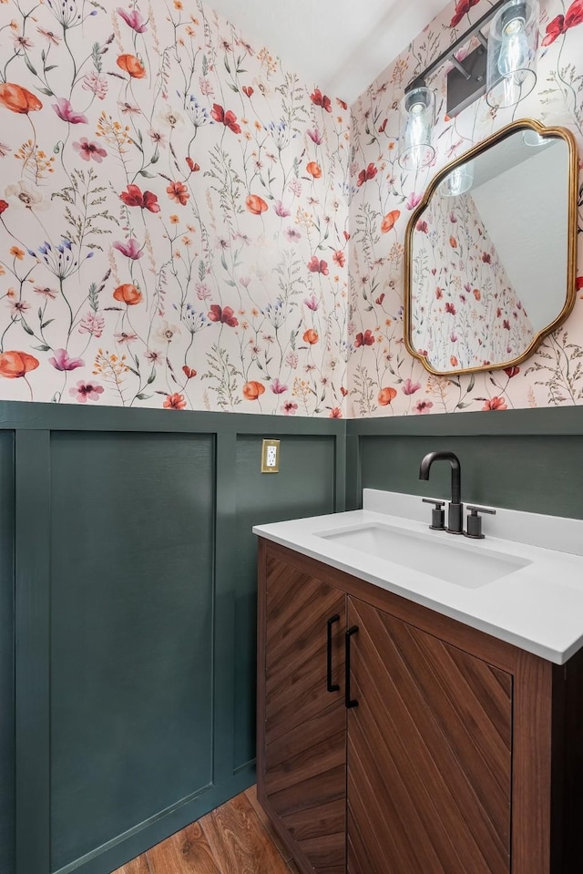 bathroom featuring hardwood / wood-style flooring and vanity