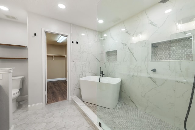 bathroom featuring hardwood / wood-style flooring, separate shower and tub, and toilet