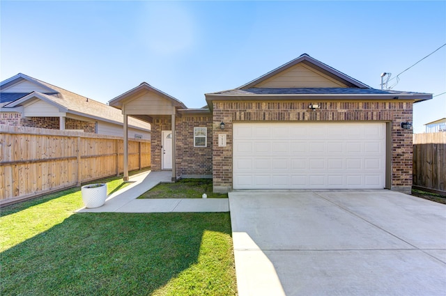 single story home with a front yard and a garage