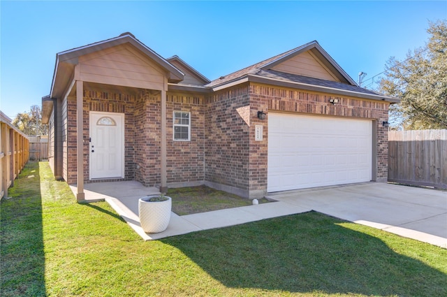 single story home featuring a front lawn and a garage