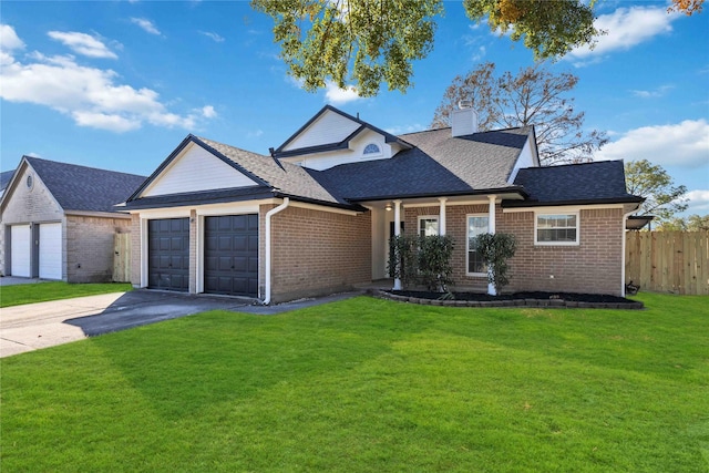 view of front of home featuring a garage and a front yard