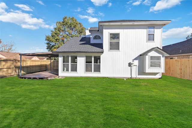 rear view of house with a lawn