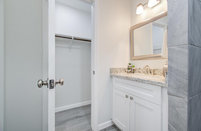 bathroom featuring vanity and hardwood / wood-style flooring