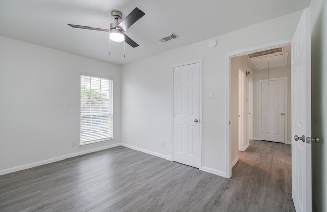 unfurnished bedroom with hardwood / wood-style floors and ceiling fan