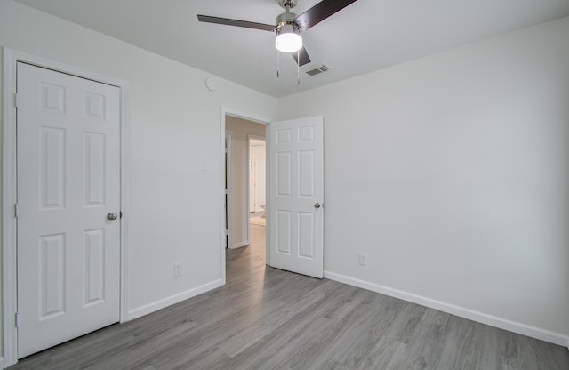 unfurnished bedroom featuring ceiling fan and light wood-type flooring