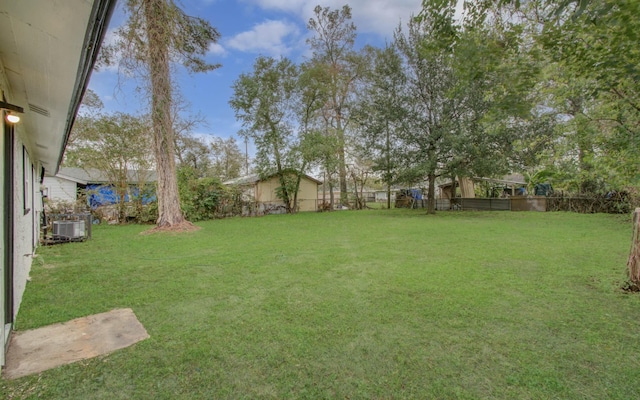 view of yard featuring central AC