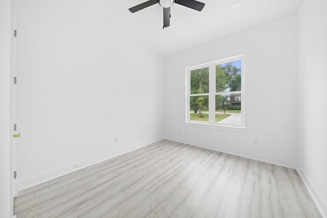 spare room featuring ceiling fan and light hardwood / wood-style flooring