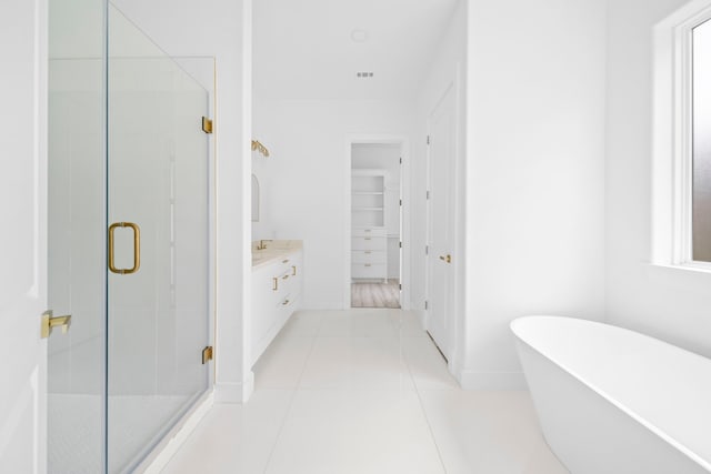 bathroom featuring tile patterned flooring, vanity, and independent shower and bath