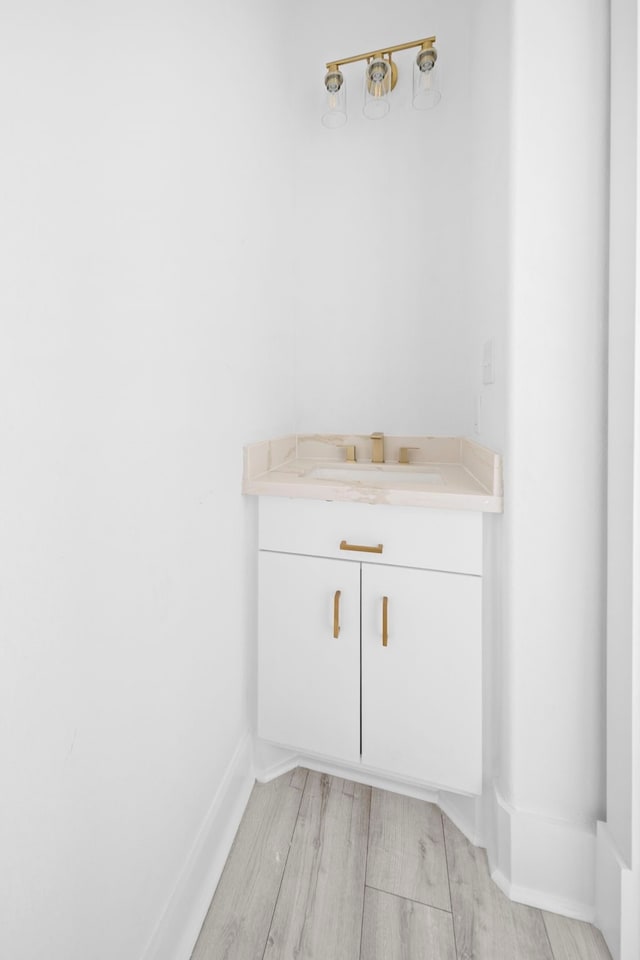 bathroom featuring hardwood / wood-style floors and vanity