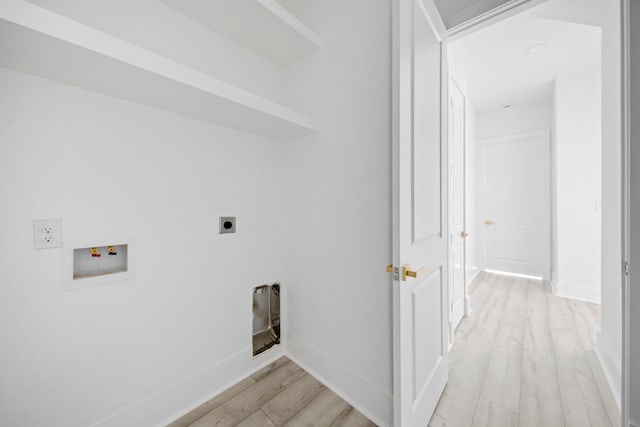 washroom featuring washer hookup, electric dryer hookup, and light wood-type flooring