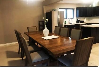 dining area featuring light tile patterned flooring and sink