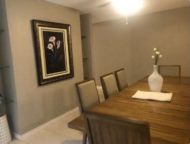 711 N Hyannis Port St, Crosby, TX 77532 - dining area featuring baseboards