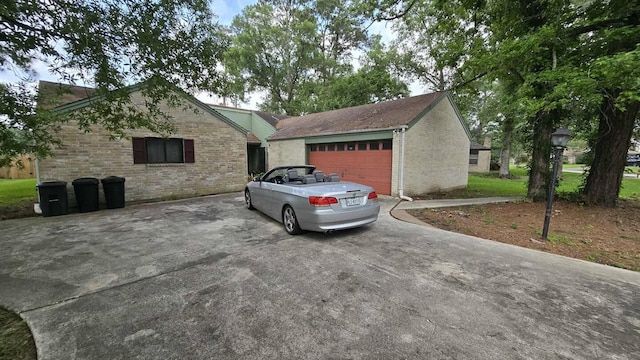 711 N Hyannis Port St, Crosby, TX 77532 - view of home's exterior with brick siding and a garage
