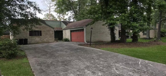 711 N Hyannis Port St, Crosby, TX 77532 - view of front of property with concrete driveway, a garage, and brick siding