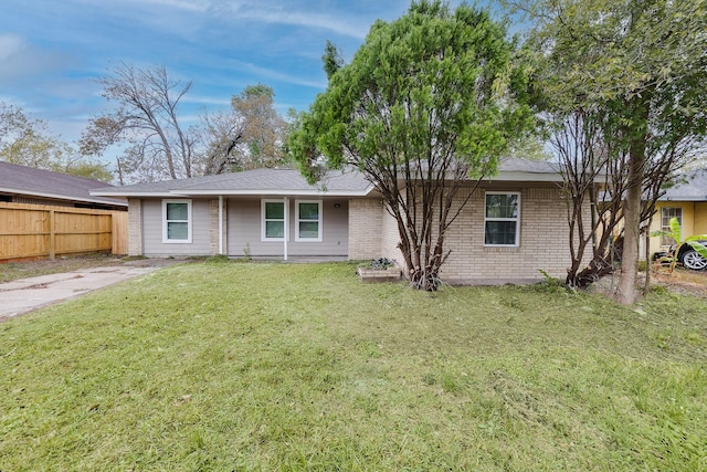 back of house with a lawn