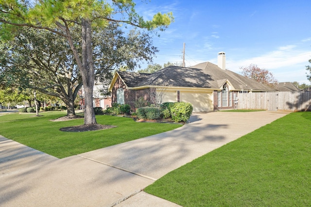 single story home featuring a front lawn and a garage