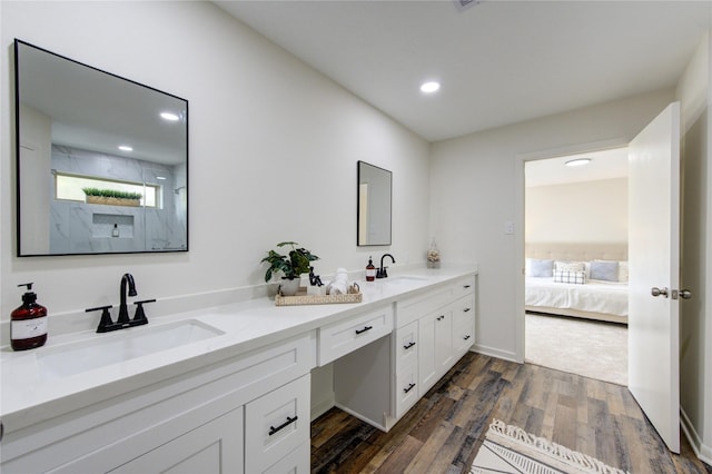 bathroom with hardwood / wood-style floors and vanity