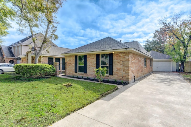 view of front of house with a front yard and a garage