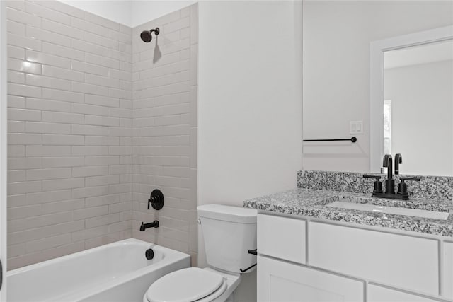 full bathroom with vanity, toilet, and tiled shower / bath