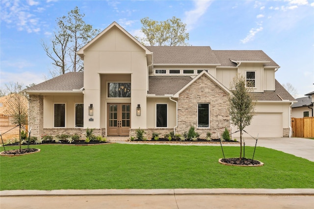 view of front facade featuring a garage, a front yard, and french doors