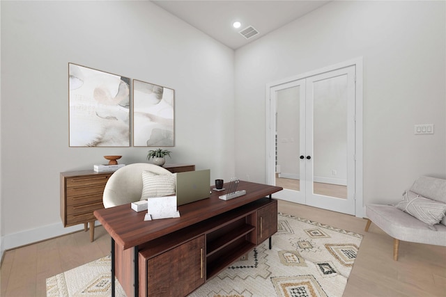 office area with french doors and light wood-type flooring