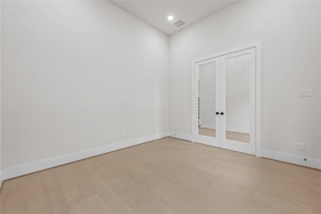 unfurnished room with light wood-type flooring