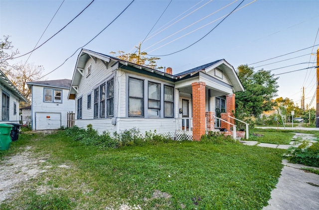 bungalow with a front yard