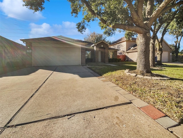 ranch-style home with a front lawn and a garage