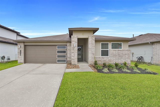 view of front facade featuring a garage and a front lawn