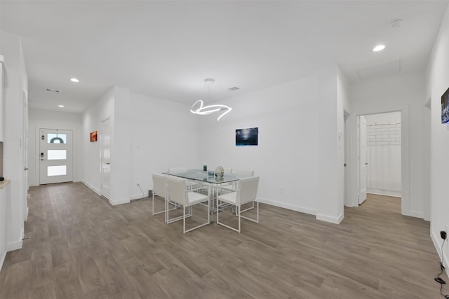 unfurnished dining area featuring hardwood / wood-style flooring