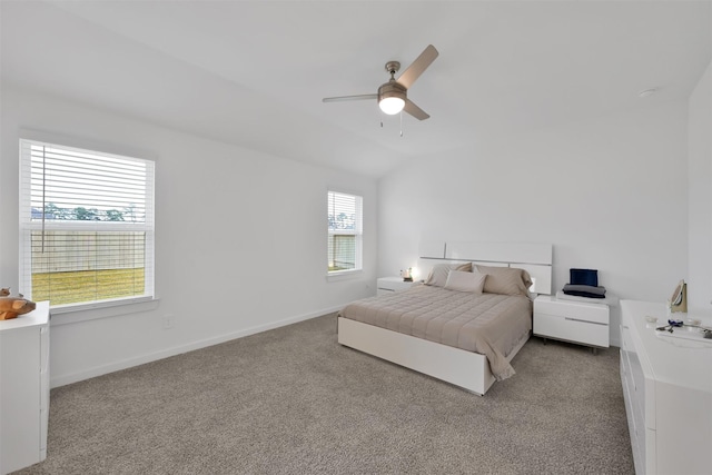 carpeted bedroom featuring ceiling fan and lofted ceiling