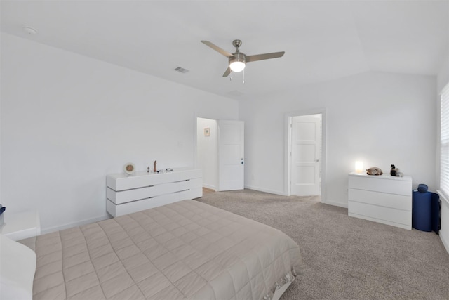 carpeted bedroom featuring ceiling fan and vaulted ceiling