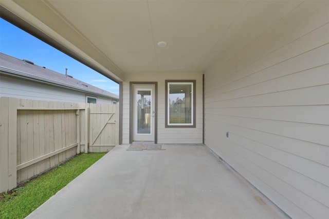 entrance to property with a patio