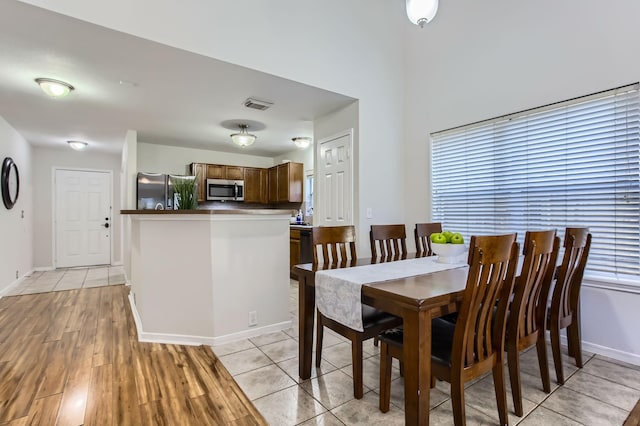 dining room with light wood-type flooring