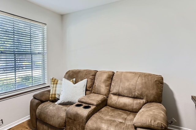 living area with hardwood / wood-style flooring