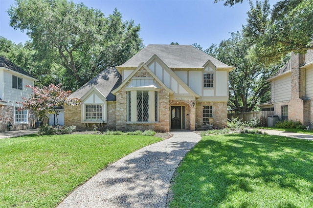 tudor house with a front yard