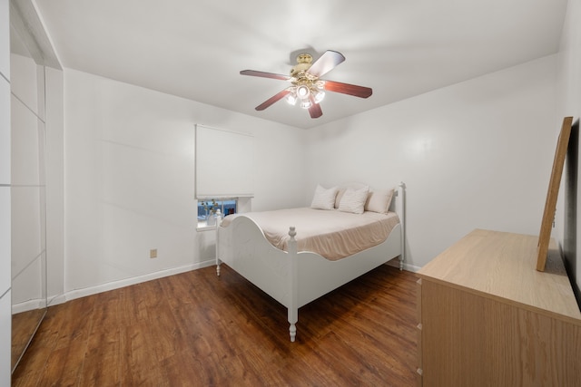 bedroom featuring ceiling fan and dark hardwood / wood-style floors