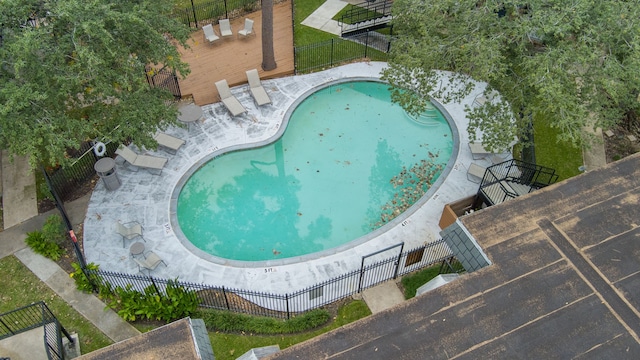 view of swimming pool with a patio