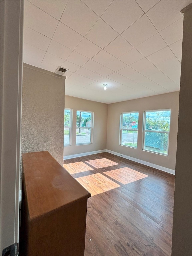 unfurnished living room featuring hardwood / wood-style flooring