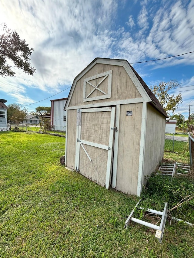 view of outbuilding with a lawn