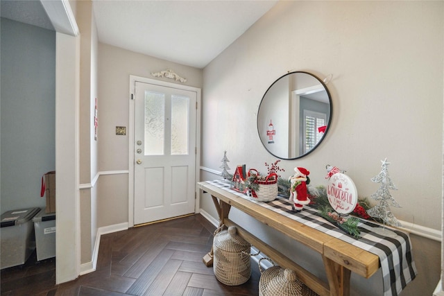 entryway featuring dark parquet floors