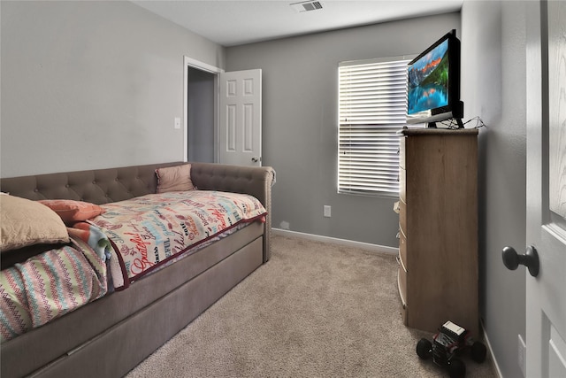 bedroom with light carpet