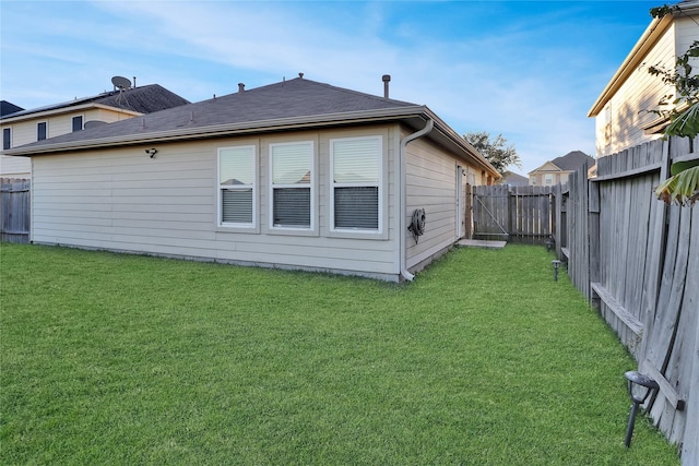 view of property exterior with a yard