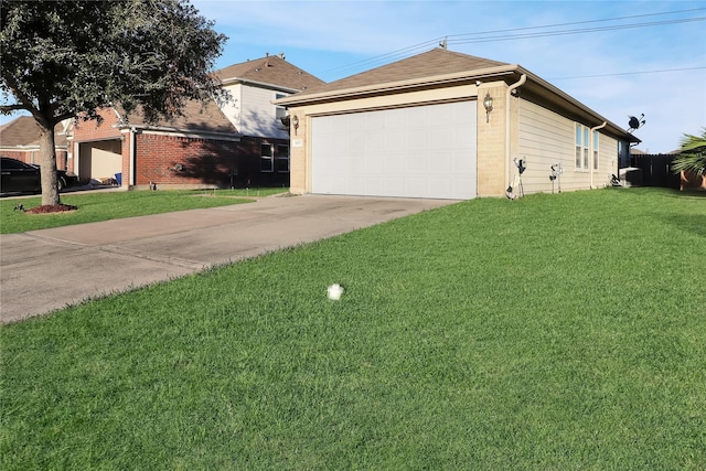 view of side of property featuring a yard and a garage