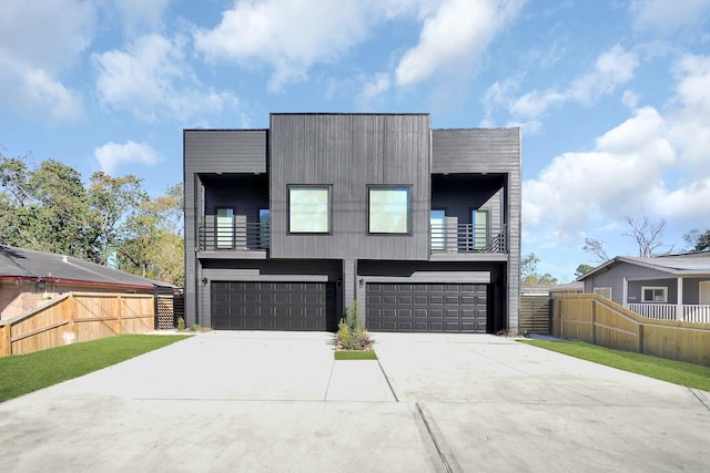 contemporary house with a balcony and a garage