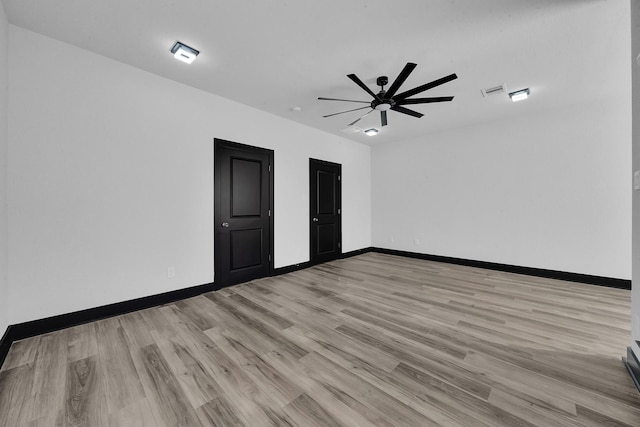 unfurnished bedroom featuring ceiling fan and light hardwood / wood-style floors